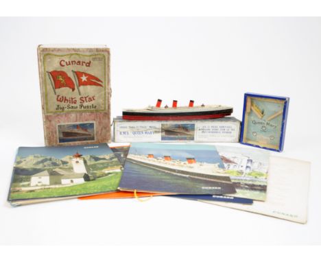 A collection of R.M.S. 'Queen Mary' memorabilia, including a Cunard White Star jigsaw puzzle, Chad Valley constructible model