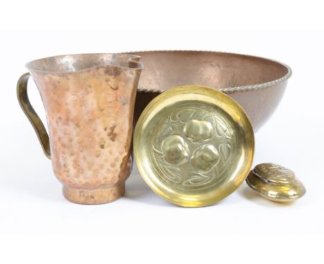 An Arts and Crafts style hammered copper circular bowl, stamped 'Dryad Lestier 30', together with a hand beaten mug stamped '