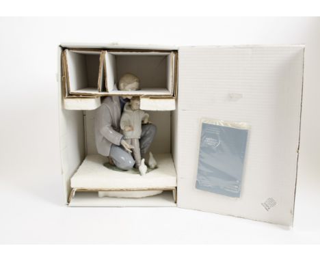 A Lladro ceramic figure group, 'A Day with Dad', 26.5 cm high, in original box