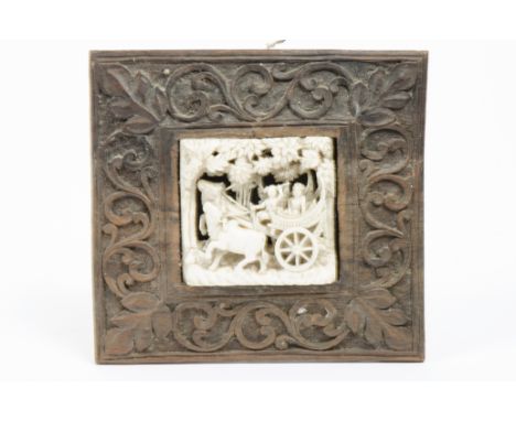 A 19th Century Chinese ivory openwork carving of two figures in a cart pulled by oxen under a canopy of trees, 6.5 cm high x 