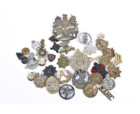 A Victorian Royal Artillery Helmet badge, together with a selection of other cap badges, to include Royal Scots Fusiliers, Ar