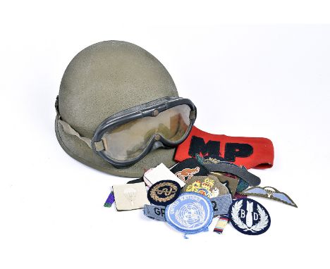 A miscellaneous lot, comprising an American helmet with A.A.F Type B-8 polaroid flying goggles, Royal Engineers cap, a copper