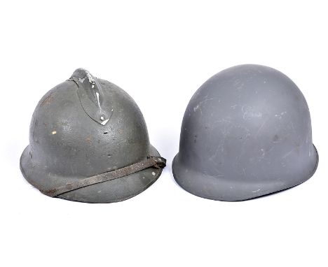 A WWI period French military helmet, together with a Danish M1 helmet with liner (2)