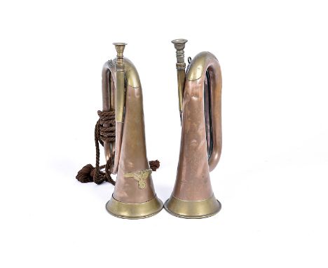A Third Reich brass and copper bugle, the instrument having applied eagle and swastika badge, together with another example b