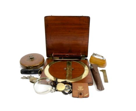 A miscellaneous collection, including a Newton &amp; Co cased brass protractor, a vintage Ronson table lighter, gaming dice, 