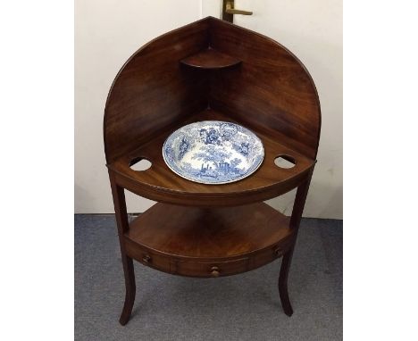 A 19th Century mahogany and ebony strung bowfront corner washstand, two tiers, shaped gallery with shelf, undertier with sing