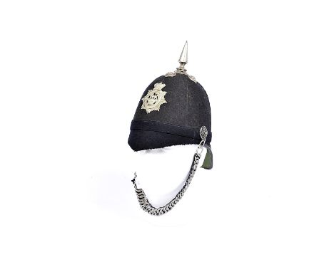 A Victorian Volunteer's blue cloth cork spike helmet, with white metal Honi Soit Qui Mal Y Pense helmet plate, velvet backed 