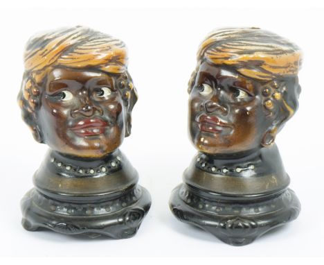 A pair of 1920s American&nbsp;ceramic money boxes in the form of Afro-American female heads, 16 cm high (2)