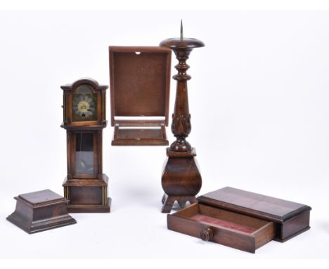 A collection of treen items, including a 19th Century mahogany pricket candlestick, 47.5 cm high; a miniature mahogany and br