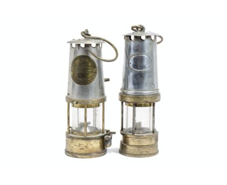 Two miners type safety lamps in brass and metal, one marked 'The Protector Lamp and Lighting Co Ltd Eccles Manchester', the o