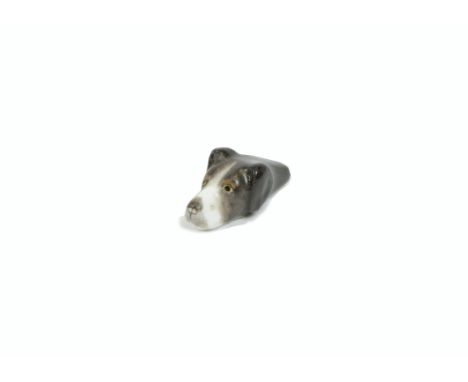 A Royal Worcester porcelain dog's head whistle, puce mark to base