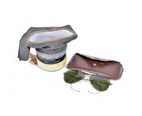 A pair of Army Air Force sunglasses, serial ARMJ 81-4763, together with a gas mask, both in original cases