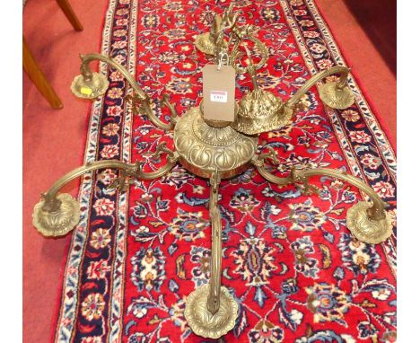 A Dutch style floral cast brass six-light hanging electrolier, having shaped branch arms 