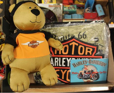 A box of Harley Davidson related reproduction signage and a Harley Davidson plush toy