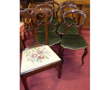 A set of six mid-Victorian mahogany balloon back dining chairs, having green dralon upholstered stuffover seats, raised on ca