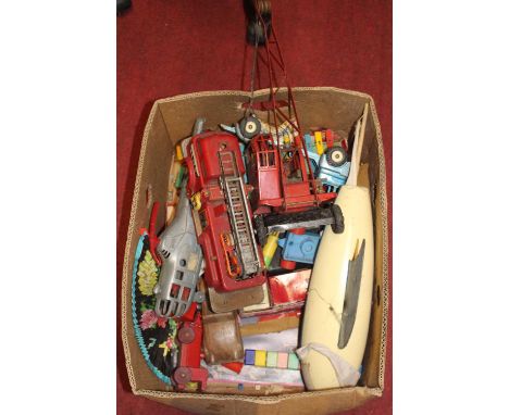 A box of miscellaneous effects to include a Triang crane, a tinplate fire brigade fire engine, and other examples