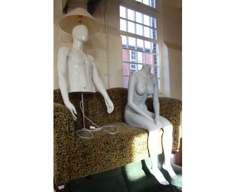 Three mannequins on stands converted into lamps plus a female mannequin in sitting position