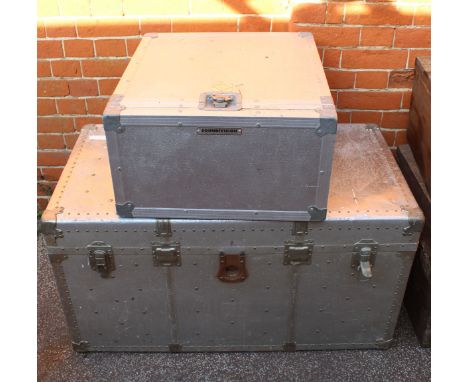 A metal storage trunk plus an aluminium flight case
