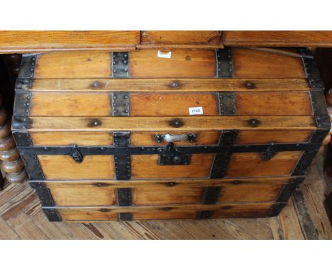 A dome topped metal bound pine trunk