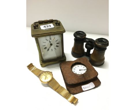 A brass and glass cased carriage clock, binoculars, Rotary wristwatch and brass cased pocket watch.