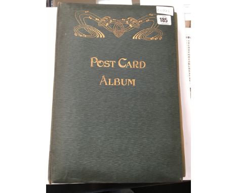 An early 20th century postcard album, partly filled, containing various postcards including topographical, music hall artists