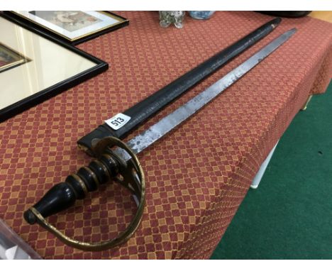 A Georgian training sword with a brass pommel, turned wood handle and leather scabbard, stamped 33 indicating a possible conn