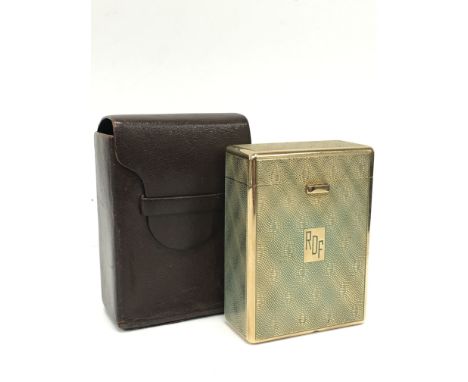 A Dunhill 9 carat gold cigarette case with engine turned leaf decoration, push button lift top lid, hallmarked Birmingham 196