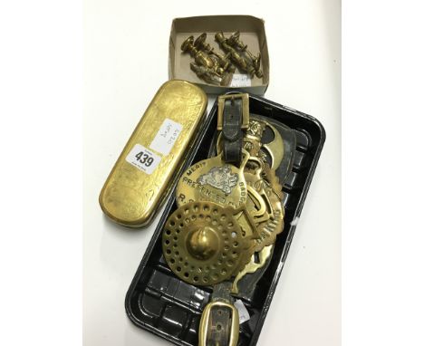 A Dutch brass engraved snuff box of oval form together with a collection of early horses brasses and other items.