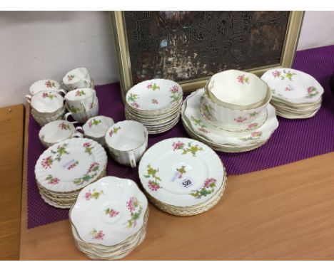 The residue of a Coalport bone china tea service decorated in a trailing blossom design.