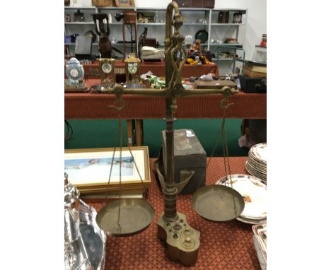 A set of reproduction brass scales. 