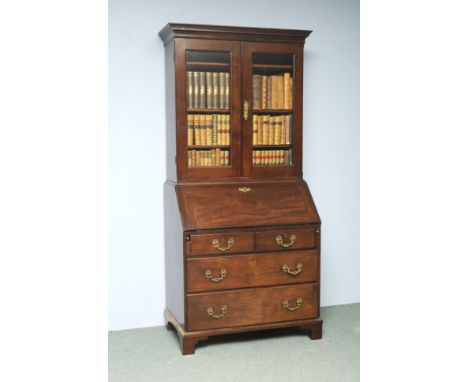 A George II Mahogany Bureau Bookcase. 2 glazed doors above Bureau with fitted interior with 2 small and 2 long drawers on bra