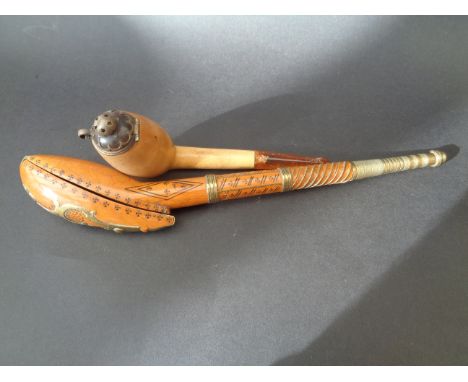 An Eastern pipe & a meerschaum and amber lidded pipe