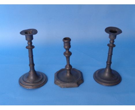 A pair and a single Pewter Candlestick