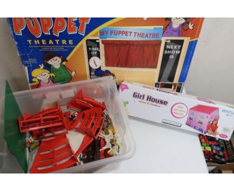 Boxed wooden Puppet Theatre with velvet curtains, collection of Playmobil figures and animals including circus, some Lego, an