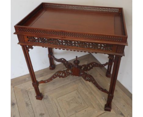 Chippendale style mahogany rectangular silver table, with fret work gallery and frieze on four cluster column supports with x