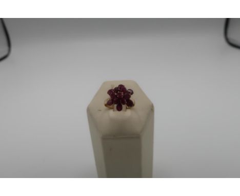 Burmese multi stone ruby flowerhead ring with unmarked yellow metal mounts (tested 22 - 24ct) 