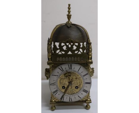 Late 19th C lantern clock with silver chapter ring and engraved decoration (converted to quartz but retaining original two tr