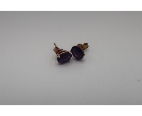 Pair of yellow metal mounted amethyst earrings 