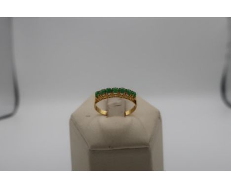 Burmese made high grade gold and seven stone jade ring (tested 22 - 24ct) 