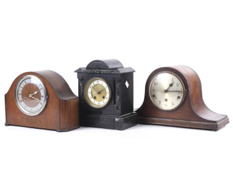 Three assorted mantel clocks. Including a Hamburg American Clock black slate striking mantel clock, H27cm; an oak cased Engli