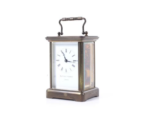 A Swiss made brass five glass carriage clock circa 1900. Retailed by Matthew Norman, London. Eight day movement with visible 