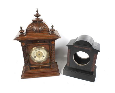 Two vintage mantel clock cases. Comprising a black marble mantel clock case. H29cm, and a mahogany case, H45cm