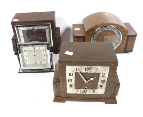 Four Art Deco style mantel clocks sold as parts. Of various designs, all with wooden cases, Max. H20cm