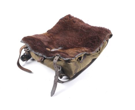 A WWII German army animal skin Walsrode rucksack. Dated 1940, with leather straps and fur covered flap. Marked in pen inside 