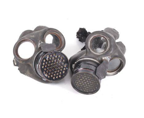 Two WWII British army/home front ARP civilian duty gas masks Condition Report: The main body of the masks appears intact, the