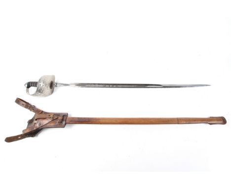 A British 1897 pattern infantry officer's sword. The hilt pierced with the crown and 'ERI', the blade etched with crown and '