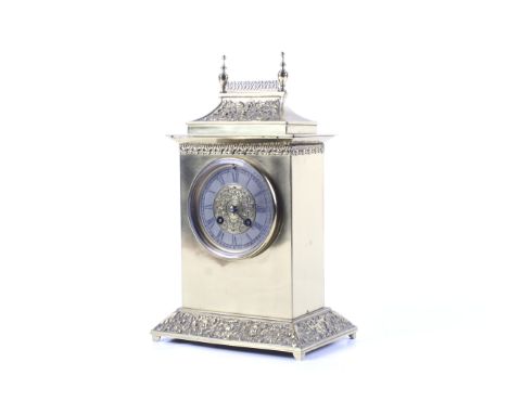 A French neoclassical brass cased 8 day striking mantel clock. Having cast neoclassical decoration to the rectangular case, p