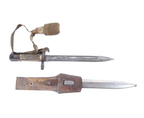 An Austrian WWI bayonet dagger. Marked FGGY below guard, with bone handle, in metal scabbard and original leather holder. Tot