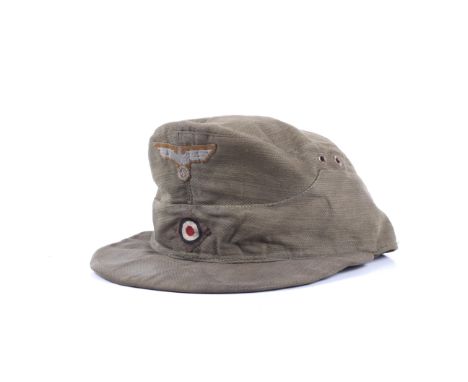 A German DAK M41 Africakorps tropical field cap. Stamped 'M/34' and '56' to the red lining, with replaced inner sweat band 