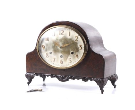A 20th century arch top Westminster chiming mantel clock. 8 day mechanism, oval silvered dial with Arabic numerals, bevelled 